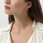 The Chain Addiction gold plated mismatched dangle earrings with links and pearls-