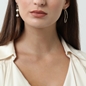 The Chain Addiction gold plated mismatched dangle earrings with links and pearls-